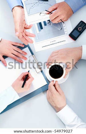 Close-up of people hands during business conversation