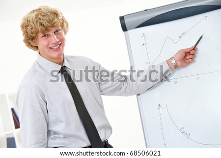 Image of successful businessman showing his project at whiteboard