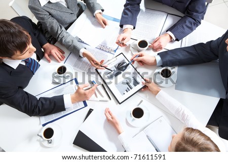 Above view of business team discussing papers