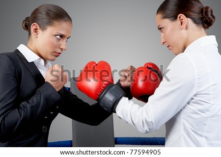 Photo of aggressive business women fighting with each other