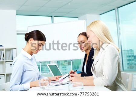 Portrait of three females working in office