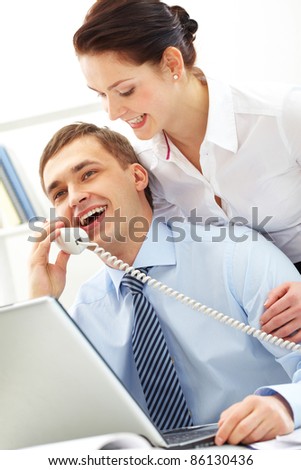 Photo of smart businessman calling with secretary near by