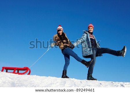 Portrait of happy couple in warm clothes spending time outdoor in winter