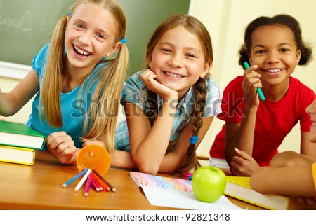 Portrait Of Joyful Schoolgirls Laughing In Classroom Stock Photo ...