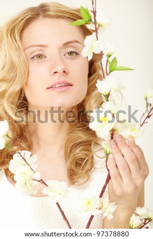 Portrait of lovely lady with white flowers