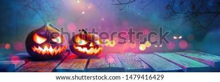  Jack O' Lanterns Glowing In Fantasy Night. Halloween Background