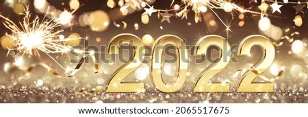 Happy New Year 2022. Golden Background with Confetti