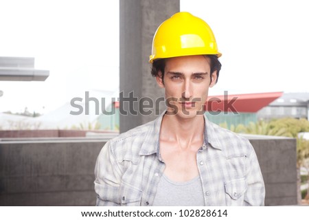 portrait of a young construction worker on location
