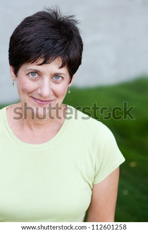 portrait of a smiling mature woman taken outside