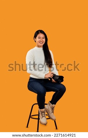 Similar – Image, Stock Photo Female photographer working on photos on laptop and camera