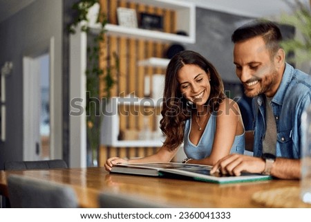 Similar – Image, Stock Photo Loving couple looking at each other