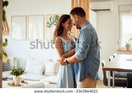 Similar – Image, Stock Photo man and woman hugging at nearby street wall