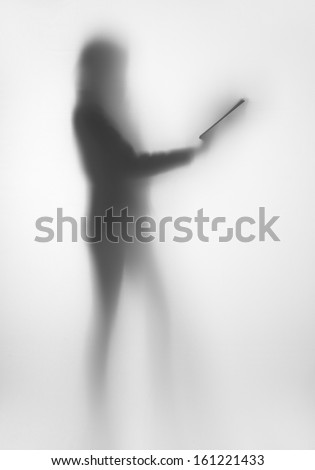 Diffuse woman body shape silhouette, with book in hands