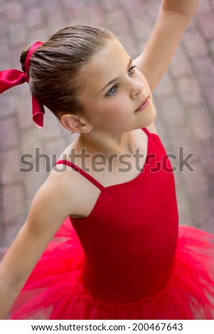 Little girl ballerina in red tutu