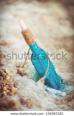 Wedding decoration at sea love letter message in bottle with starfish in water at tropical resort. Romantic and travel concept. Sea beach and ocean. Summer travel. Freedom and dating concept