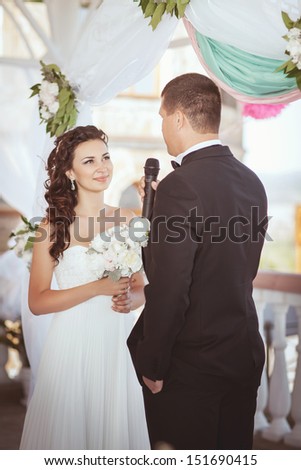 Bride and groom at wedding ceremony. Happy newlywed couple at marriage ceremony. Smiling bride and groom. Beautiful couple in love at honeymoon Thailand. embracing bride and groom. wedding day. series
