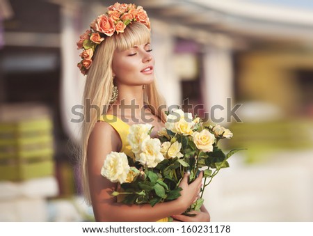 Beautiful young woman portrait, attractive woman with flowers wreath, France. Healthy teenager girl. Sensual woman natural beauty. Spring woman with flowers.