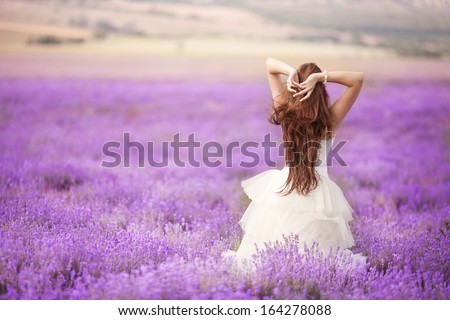 Similar – Image, Stock Photo Woman with lavender flowers near the purple minivan