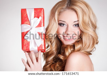 Happy young woman with gift box birthday or Valentines Day party. Beautiful smiling girl with gift. Shopping sales.Joyful woman with presents. Isolated, studio, white background.