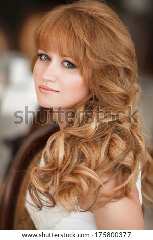 Beautiful red hair woman portrait, young pretty girl in cafe. Woman with long ginger hair outdoors. young skin, perfect face. Summer vacation girl. Lifestyle photo.
