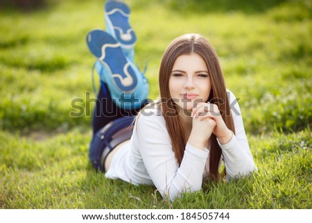 cheerful teenager girl portrait at spring green park, happy young college student at vacation, lifestyle beautiful woman on nature. series.