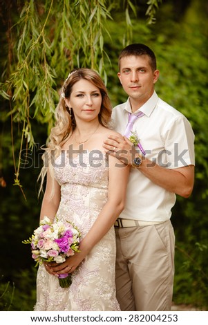 Bride and groom wedding portrait outdoors newlyweds loving couple kissing marriage bridal flowers, kissing man and woman at wedding day, selective focus, series