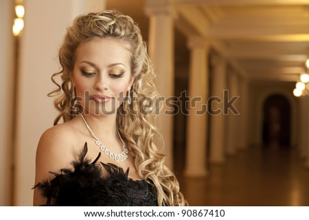 Fashion luxury retro portrait of beautiful young woman thinking dreaming smiling sexy girl with diamond necklace jewelery in the theater hall i classic Interior art girl blond hair closeup