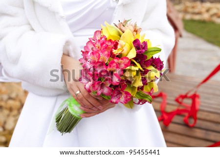 Wedding bouquet with orchids in bride hands - wedding accessories