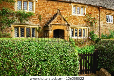 Old country stone house hedgerow wooden door