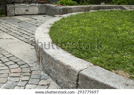 Detail of back yard paved house garden