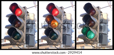 The traffic light fixed on a column at a crossroads
