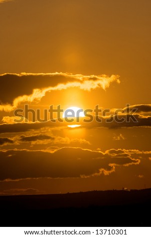 Wonderful sunset with the cloudy sky. Russia, Ural.