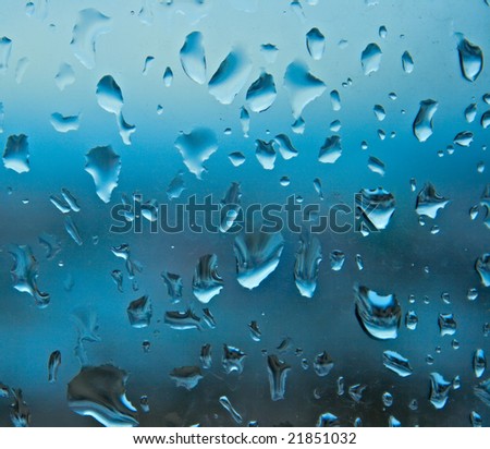 Drops of evening rain on the window glass