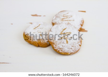Christmas gingerbread cookie, sprinkled with powdered sugar