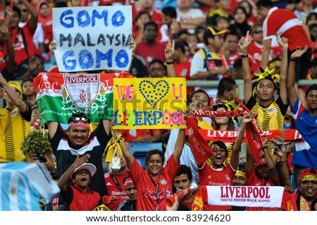 KUALA LUMPUR - JULY 16 : Liverpool football club fans cheer during a friendly match against Malaysia XI on July 16, 2011 in Kuala Lumpur, Malaysia. Liverpool won 6-3.