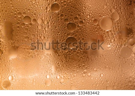 Colorful Bubbles on a Glass Surface Looking Like Carpets, Curtain of Bubbles,  like Planets or molecules.