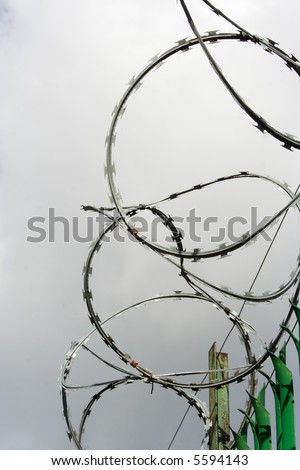 razor wire with white clouds as background
