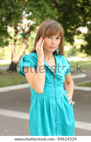 The beautiful girl in a turquoise dress