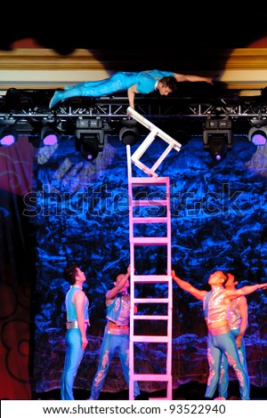 LINCOLN, CA - JAN 20: The Chinese Acrobats Of Hebei perform chair balancing at Thunder valley Casino in Lincoln, California on January 20, 2012