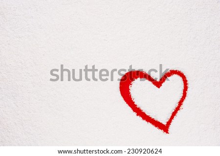 Heart shape painted on frozen window