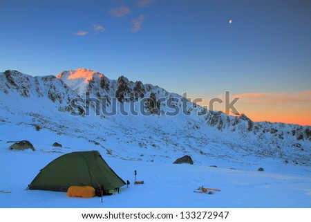 Camping on the snow, early morning in the mountains, Romania