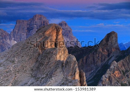 Steep mountain summits and cliffs after sunset, Dolomite Alps, Italy