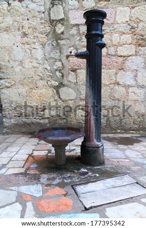 Cast iron water pump on the street of Kotor