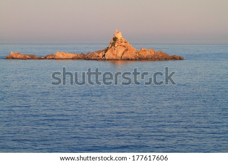 Isolated church in a rocky island on Mediterranean sea