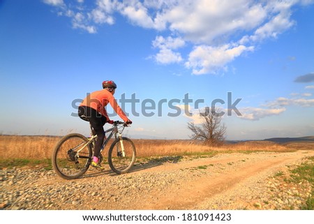 Woman during a bike ride in the countryside
