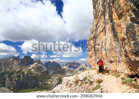 Aerial mountain trail protected with steel cable, Dolomite Alps, Italy