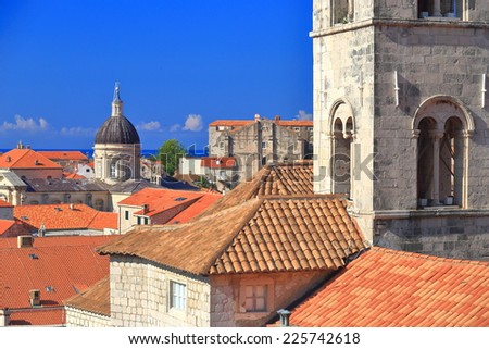 Dominican Monastery and distant tower of the Cathedral-Treasury inside the old town of Dubrovnik, Croatia