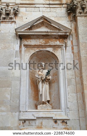 Detail with a stone sculpture on a church inside old Venetian town of Dubrovnik, Croatia