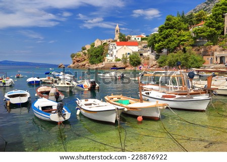 Fishing boats inside small town harbor on the Dalmatian coast, Croatia