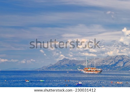 Vintage tourist boat navigating along Dalmatian coast, Makarska, Croatia